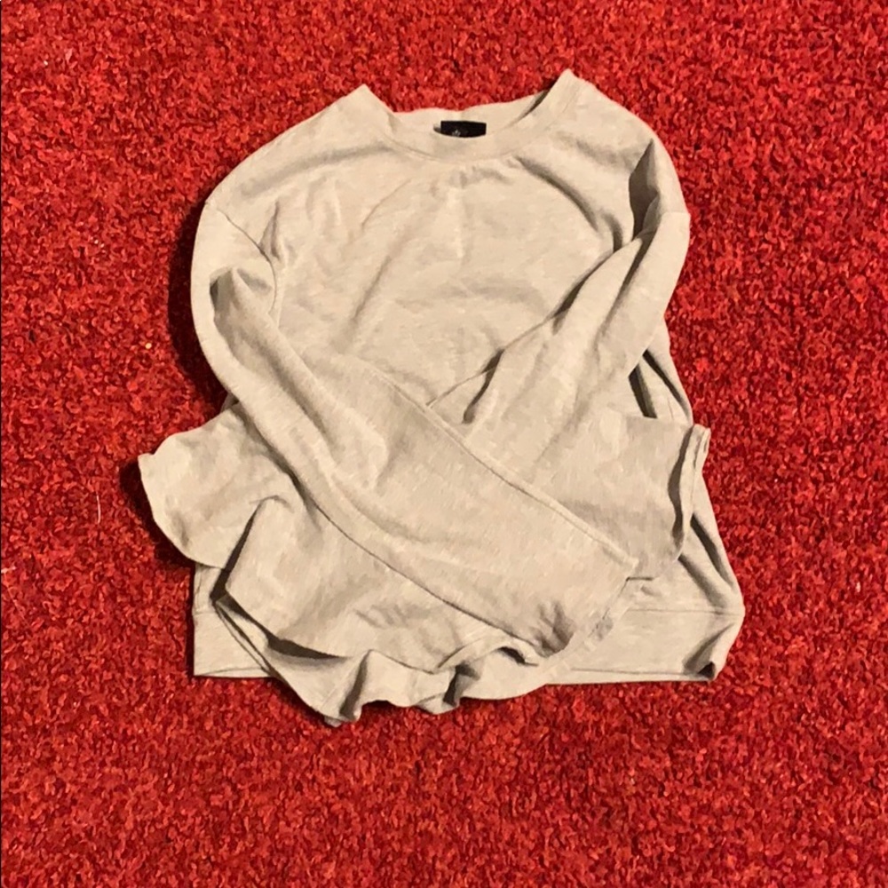 a gray sweater